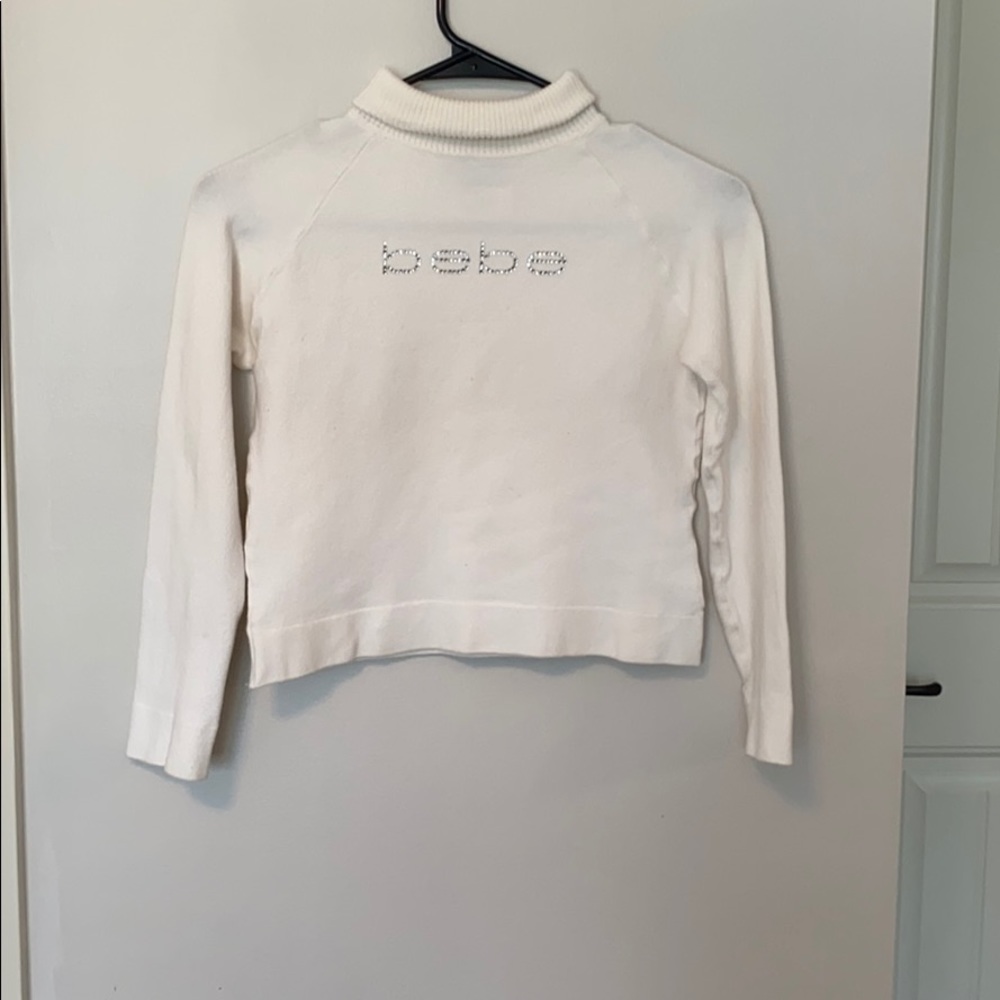 White Bebe crop top sweater.